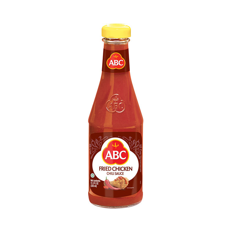 ABC Fried Chicken pictured in a glass bottle with an image of flour coated fried chicken drizzled with chili sauce. 
