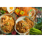 Lifestyle photograph of Indonesian style fried rice in bowls. 