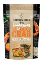 The Golden Duck Salted Egg Crab Seaweed Tempura from Singapore. A couple pieces of crunchy seaweed tempura is shown in the bag 102 gr. A logo of duck is shown on top of the bag.
